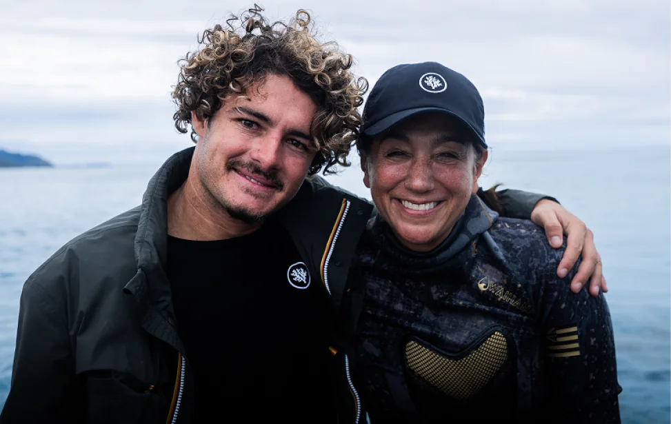 Titouan and Cristina Mittermeier on a boat, arms around each other and smiling