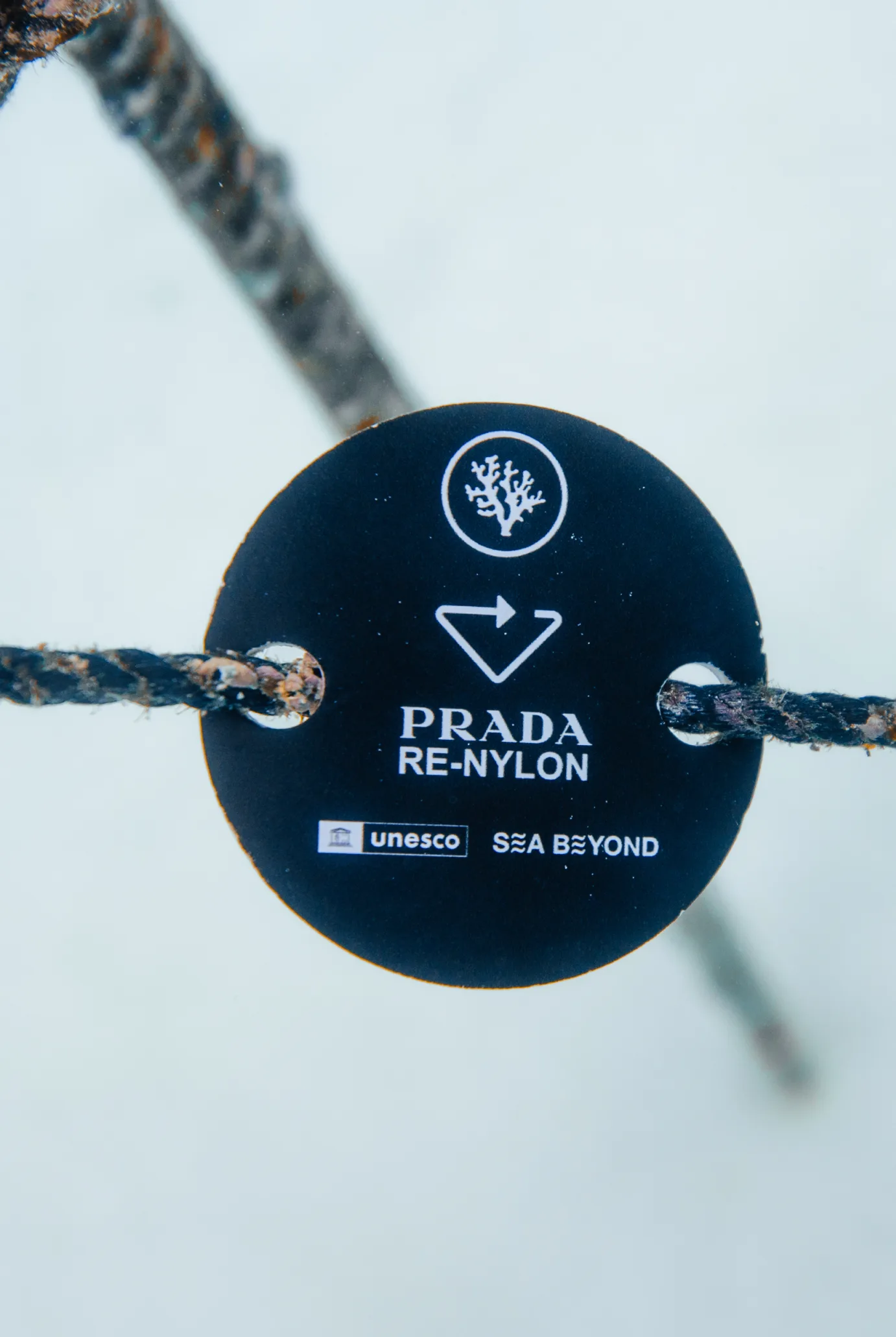 A Prada Re-Nylon tag, with UNESCO and Sea Beyond, on a Coral Gardeners nursery rope